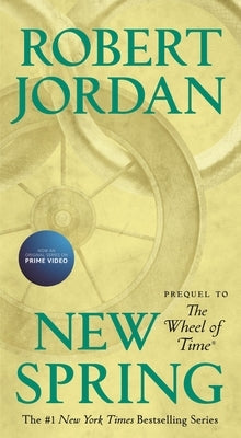 Mass market paperback of "New Spring," a prequel to the Wheel of Time series, published by Tor Books, shown with cover art.