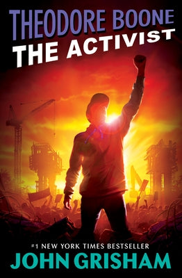Paperback of Theodore Boone: The Activist by Puffin Books, featuring the book cover with title and author details.