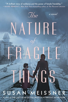Paperback copy of "The Nature of Fragile Things" by Berkley Books featuring a cover with soft pastel artwork.