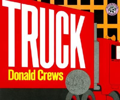 Paperback copy of "Truck: A Caldecott Honor Award Winner" children's book by Greenwillow Books, featuring colorful cover art.