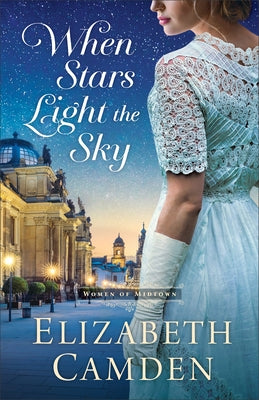 Paperback copy of "When Stars Light the Sky" by Bethany House Publishers, showing the book cover with starry night background.