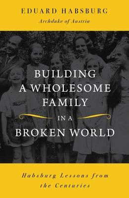 Paperback book titled "Building a Wholesome Family in a Broken World" by Sophia Institute Press, featuring a family illustration on the cover.
