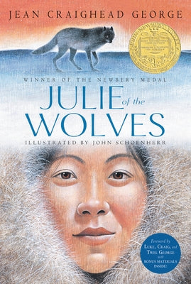 Paperback copy of "Julie of the Wolves" by HarperCollins featuring a cover image with Arctic wolf and wilderness scene.