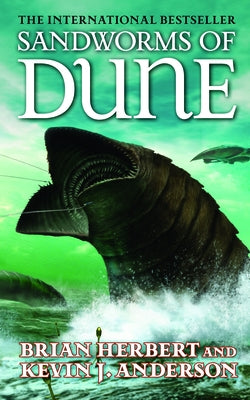 Mass market paperback of Sandworms of Dune by Tor Books, featuring a cover image with desert and sandworm illustrations.