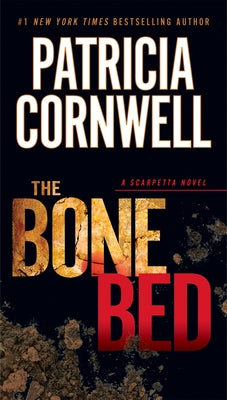 Mass market paperback of "The Bone Bed" by Berkley Books, showing the book cover with dark and eerie artwork.