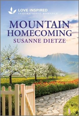 Cover of Love Inspired mass market paperbound romance novel "Mountain Homecoming," featuring scenic mountain landscape and uplifting title.