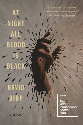 Paperback of "At Night All Blood Is Black" by Picador USA featuring the book cover with dark artwork and title text.