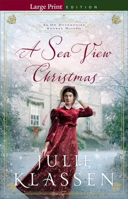A paperback copy of "A Sea View Christmas" novella by Bethany House Publishers, showing the book cover with a seaside scene.