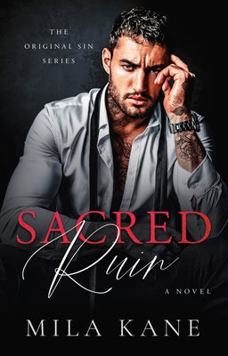 Paperback copy of Sacred Ruin novel by Dell, featuring cover art with mystical and dark fantasy imagery.