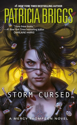 Cover of "Storm Cursed" mass market paperback by Ace Books featuring dark fantasy artwork and a mysterious stormy background.