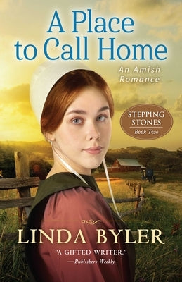 Paperback copy of "A Place to Call Home: An Amish Romance" by Good Books, featuring a cozy Amish community scene on the cover.