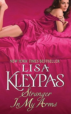 Mass market paperback of "Stranger in My Arms" by Avon Books, featuring the book cover with title and author details.