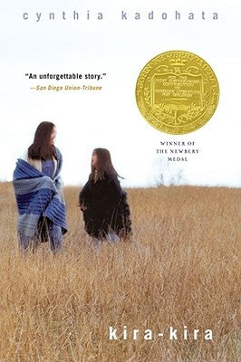 Paperback of Kira-Kira by Atheneum Books for Young Readers, showing the book cover with colorful illustrations and title text.