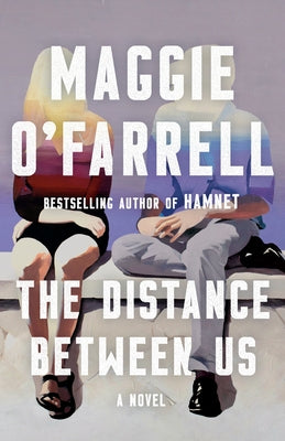 Paperback copy of The Distance Between Us novel by Vintage, showing the front cover with title and design elements.
