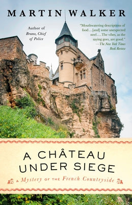 Paperback copy of "A Chateau Under Siege" by Bruno, Chief of Police, published by Vintage, showing the book cover.