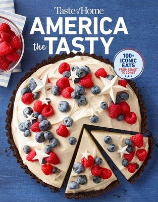 Paperback "Taste of Home America the Tasty" cookbook by Trusted Media Brands featuring colorful American-inspired recipes and culinary images.