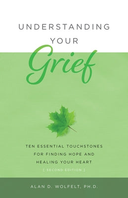 Paperback book titled "Understanding Your Grief" by Companion Press, showing the front cover with a comforting design.