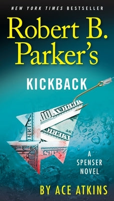 Cover of Robert B. Parker's Kickback mass market paperback book featuring dark-themed cover art and the title prominently displayed.