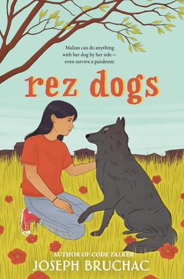 Paperback of Rez Dogs book by Penguin Young Readers Group, showing the cover with colorful illustrations and title text.