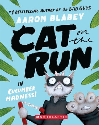 Paperback of "Cat on the Run in Cucumber Madness" by Scholastic Paperbacks featuring colorful book cover with a playful cat illustration.