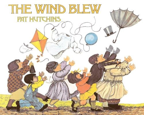 Paperback copy of "The Wind Blew" by Aladdin Paperbacks, showing the book cover with colorful illustrations.