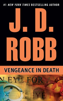Mass market paperback of "Vengeance in Death" by Berkley Books featuring a dark, dramatic cover with cityscape and shadowy figures.