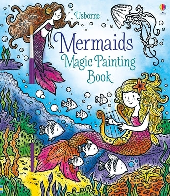 Open paperback of Usborne Books' Mermaids Magic Painting Book featuring colorful mermaid illustrations for creative painting activities.