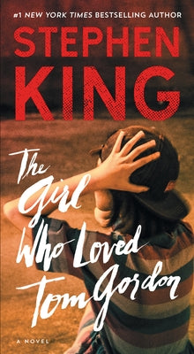 Mass market paperback of "The Girl Who Loved Tom Gordon" by Pocket Books, showing the book cover with title and author details.