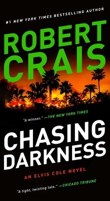 Mass market paperbound of "Chasing Darkness" by Pocket Books, featuring the book cover with dark and moody artwork.