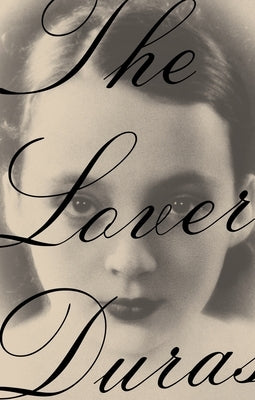 Paperback copy of "The Lover" novel by Pantheon Books, featuring the book's cover with title and artwork.