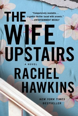 Mass market paperback of The Wife Upstairs by St. Martin's Press, featuring the book cover with dark and mysterious design.