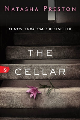 Paperback of "The Cellar" novel by Sourcebooks Fire showing the book cover with dark, mysterious artwork.