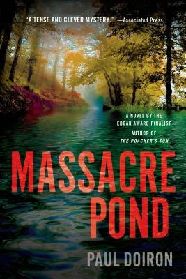 Paperback copy of Massacre Pond by Minotaur Books, showing the book cover with dark, mysterious artwork.