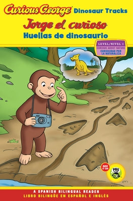 Bilingual paperback book titled "Curious George: Dinosaur Tracks" showing Curious George with dinosaur footprints on the cover.