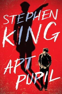 Paperback copy of Apt Pupil novel by Scribner Book Company, featuring a cover with dark artwork and title text.