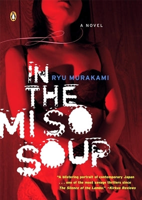 Close-up of the paperback "In the Miso Soup" by Penguin Books, showing the book cover with Japanese-themed artwork.