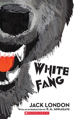 White Fang mass market paperback by Scholastic Paperbacks featuring the classic book cover with a snowy landscape and a fierce wolf dog.