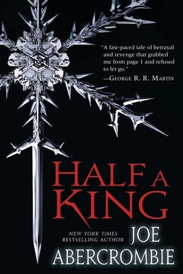 Paperback copy of "Half a King" by Del Rey Books featuring the book cover with title and author text.