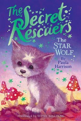 Paperback copy of The Star Wolf novel by Aladdin Paperbacks, featuring the book cover with starry sky and wolf illustration.