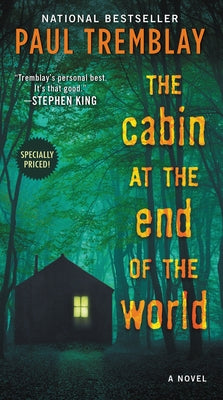 Mass market paperbound copy of "The Cabin at the End of the World" by William Morrow & Company, featuring a dark, atmospheric cover design.