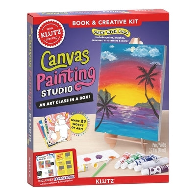 Klutz canvas painting studio setup with brushes and paints on a wooden table for creative art projects.