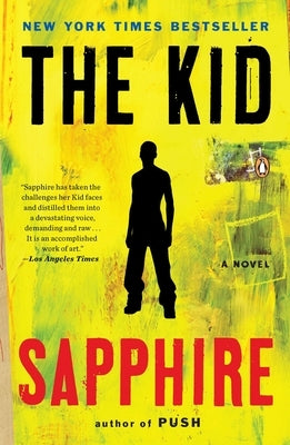 Paperback copy of "The Kid" novel by Penguin Adult HC/Tr featuring a cover image with artistic book design.