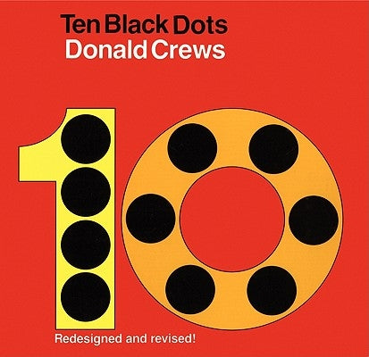 Close-up of the cover of the Ten Black Dots board book by Greenwillow Books featuring a simple black dot design.