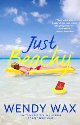 Paperback copy of "Just Beachy" novel by Penguin Publishing Group, featuring a cover image with beach-themed artwork.