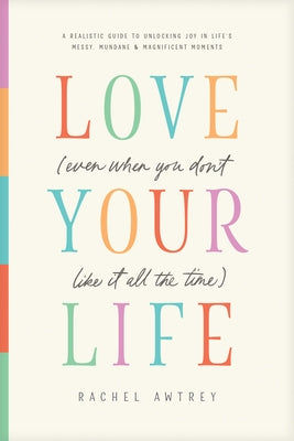 Paperback of "Love Your Life" by Tyndale Momentum, showing the book cover with title and author, in a close-up shot.