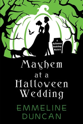 Paperback copy of "Mayhem at a Halloween Wedding" by Kensington Cozies, featuring spooky wedding scene on the cover.