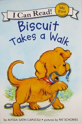 Paperback copy of "Biscuit Takes a Walk" by HarperCollins featuring the book cover with Biscuit the dog on a walk.