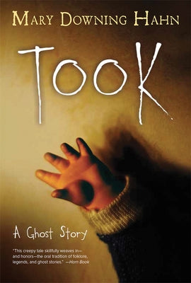 Paperback of Took: A Ghost Story by Clarion Books, showing the book cover with ghostly illustrations and title text.