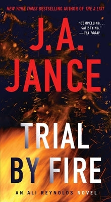 Mass market paperback of "Trial by Fire," a suspense novel, featuring a fiery scene on the cover with bold title text.