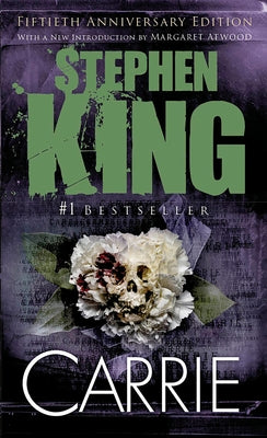 Vintage Mass Market Paperbound copy of Carrie by Stephen King, showing the book's front cover with dark, eerie artwork.